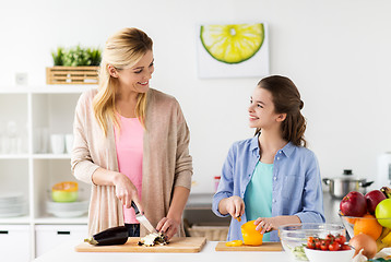 Image showing happy family cooking dinner at home kitchen