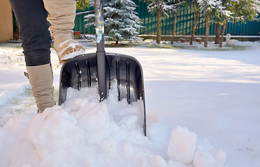 Image showing Woman Shoveling her garden