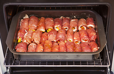 Image showing meat rolls in oven