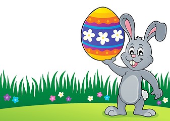 Image showing Bunny holding big Easter egg topic 3