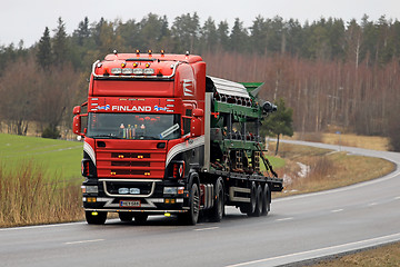 Image showing Customised Scania Truck Hauls Machinery