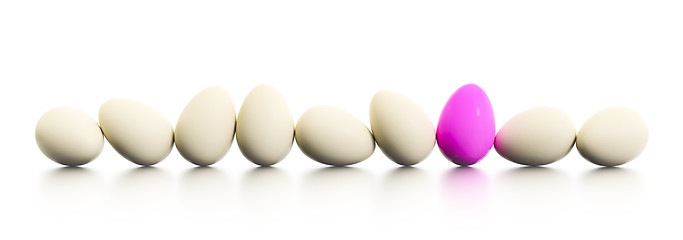 Image showing a row of easter eggs one dyed in pink