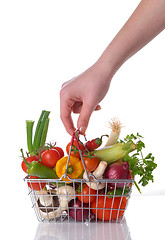 Image showing Raw vegetables in basket isolated on white