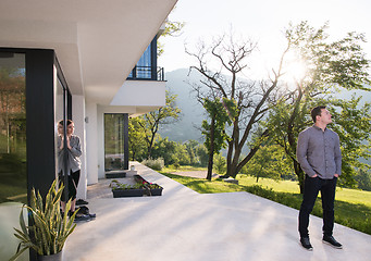 Image showing man in front of his luxury home villa