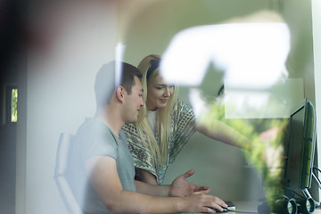 Image showing man and woman operators of security systems