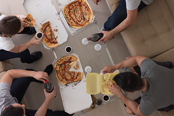 Image showing Pizza time a group of people