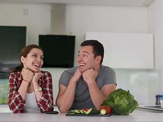 Image showing Young couple in the kitchen