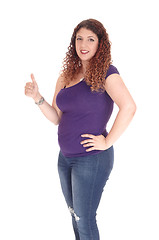 Image showing Curvy woman standing in profile with thump up