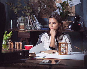 Image showing Architect working on drawing table in office