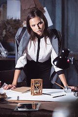 Image showing Architect working on drawing table in office