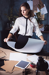 Image showing Architect working on drawing table in office