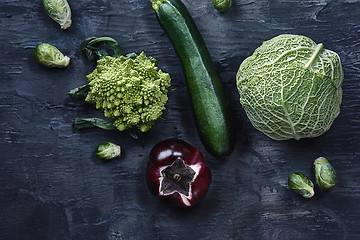 Image showing Organic vegetables on wooden table. Top view