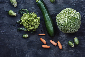 Image showing Organic vegetables on wooden table. Top view