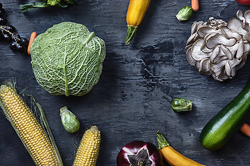 Image showing Organic vegetables on wooden table. Top view