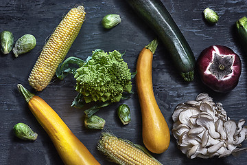 Image showing Organic vegetables on wooden table. Top view