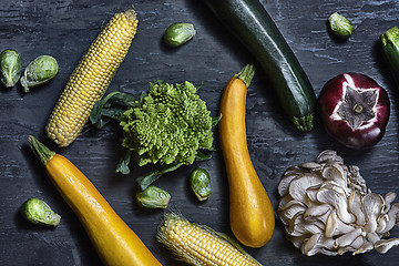 Image showing Organic vegetables on wooden table. Top view