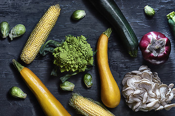 Image showing Organic vegetables on wooden table. Top view