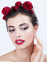 Image showing young hispanic girl with flower red rose in hairs