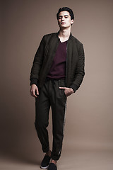 Image showing handsome fashion looking man posing in studio, lifestyle modern people concept