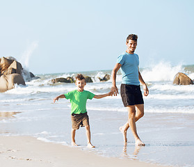 Image showing happy family on beach playing, father with son walking sea coast