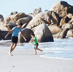 Image showing happy family on beach playing, father with son walking sea coast