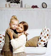 Image showing two cute sisters at home playing