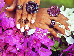 Image showing bright colorfull shot of african tanned hands with manicure amon