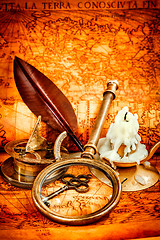 Image showing Vintage still life. Vintage items on ancient map.