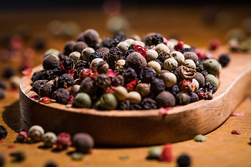 Image showing Mixed peppercorns. Dry mix peppercorns close up