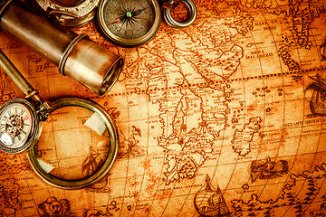 Image showing Vintage still life. Vintage items on ancient map.