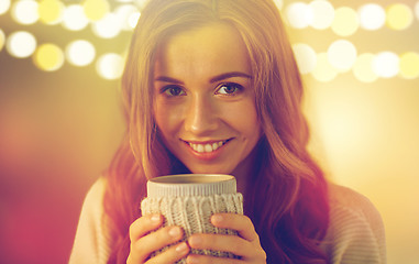 Image showing close up of woman with tea or coffee cup at home