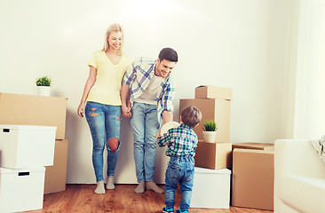 Image showing happy family moving to new home and playing ball