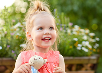 Image showing portrait of happy beautiful little girl outdoors