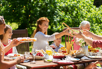 Image showing happy family having dinner or summer garden party