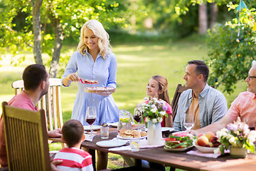 Image showing happy family having dinner or summer garden party