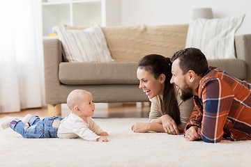 Image showing happy family playing with baby at home