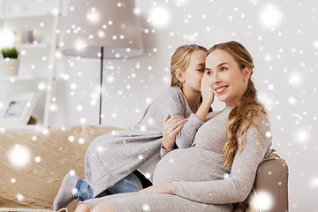 Image showing happy pregnant woman and girl gossiping at home