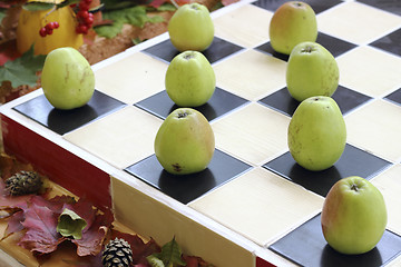 Image showing Apples on chessboard