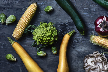 Image showing Organic vegetables on wooden table. Top view