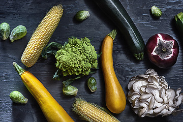 Image showing Organic vegetables on wooden table. Top view