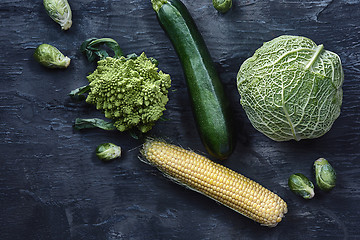 Image showing Organic vegetables on wooden table. Top view