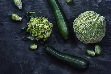 Image showing Organic vegetables on wooden table. Top view