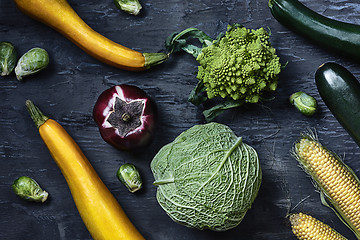 Image showing Organic vegetables on wooden table. Top view