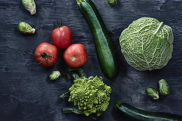 Image showing Organic vegetables on wooden table. Top view