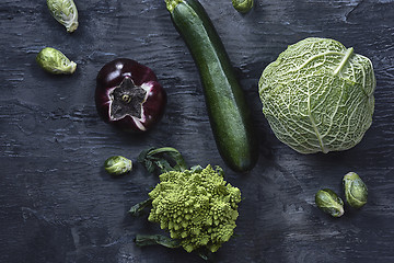 Image showing Organic vegetables on wooden table. Top view