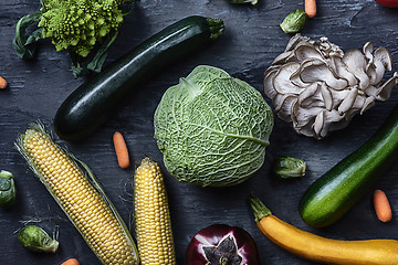 Image showing Organic vegetables on wooden table. Top view