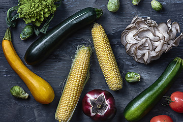 Image showing Organic vegetables on wooden table. Top view