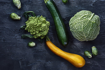 Image showing Organic vegetables on wooden table. Top view