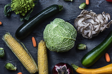 Image showing Organic vegetables on wooden table. Top view