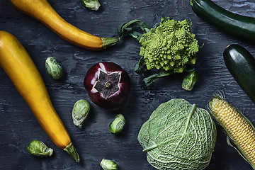 Image showing Organic vegetables on wooden table. Top view